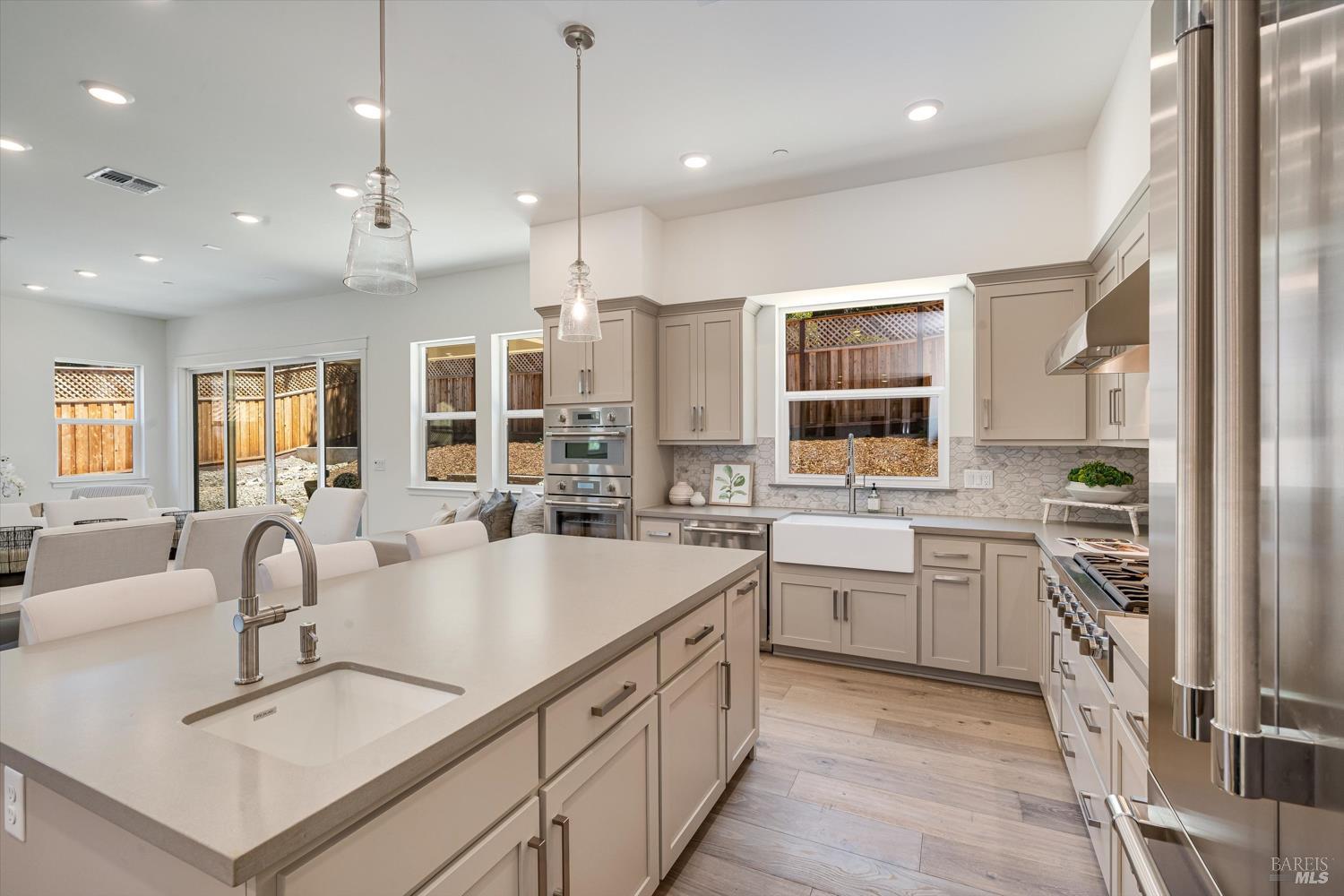 107 Grace Lane Napa, CA 94559 - Photo 14 of 39 a large white kitchen with a large window