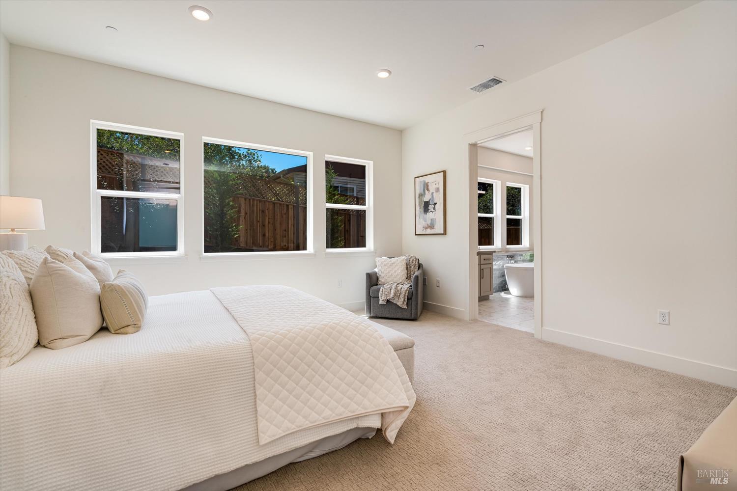 107 Grace Lane Napa, CA 94559 - Photo 19 of 39 a bedroom with bed and a large window