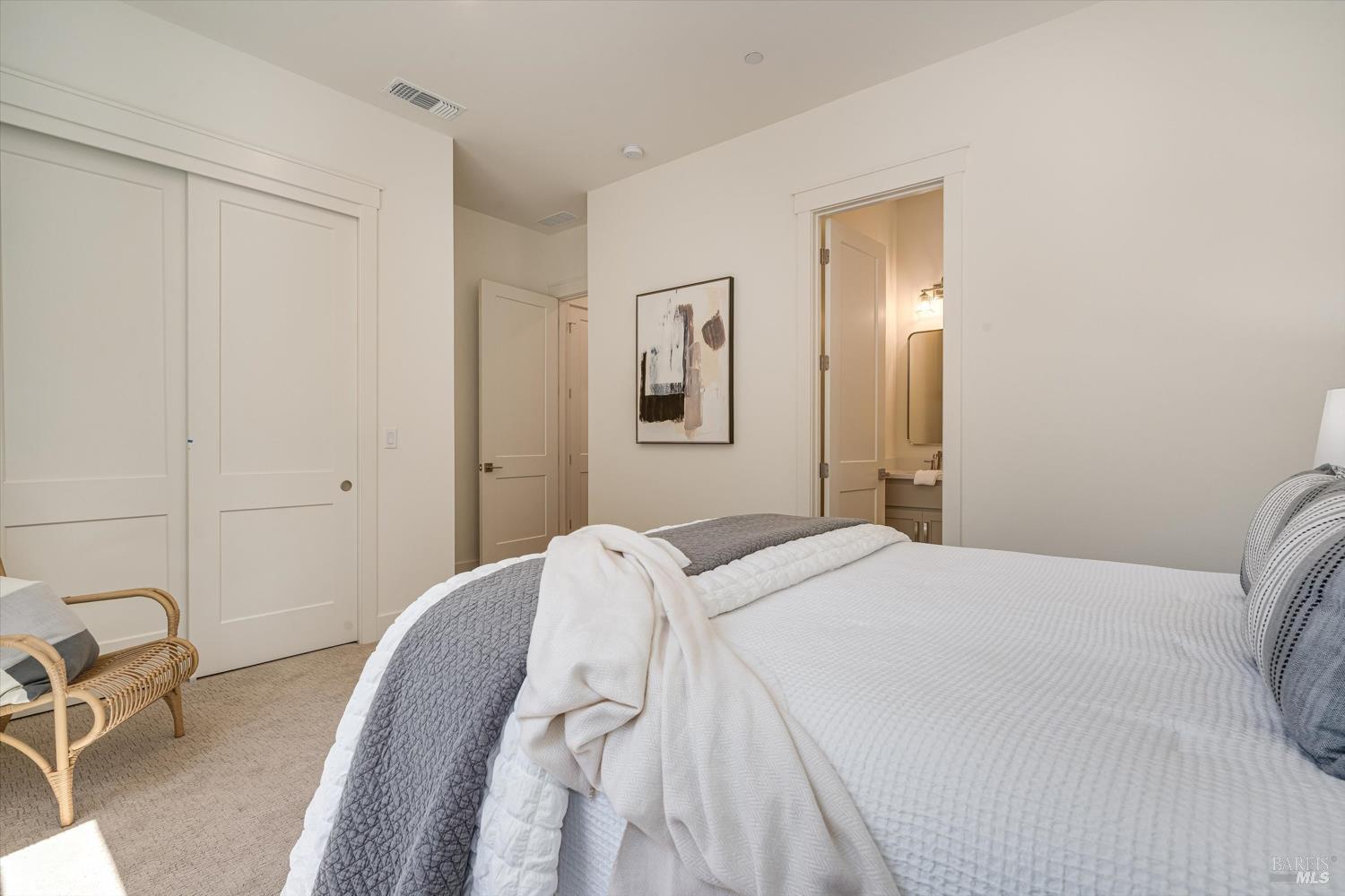 107 Grace Lane Napa, CA 94559 - Photo 23 of 39 a bedroom with a bed and painting on the wall