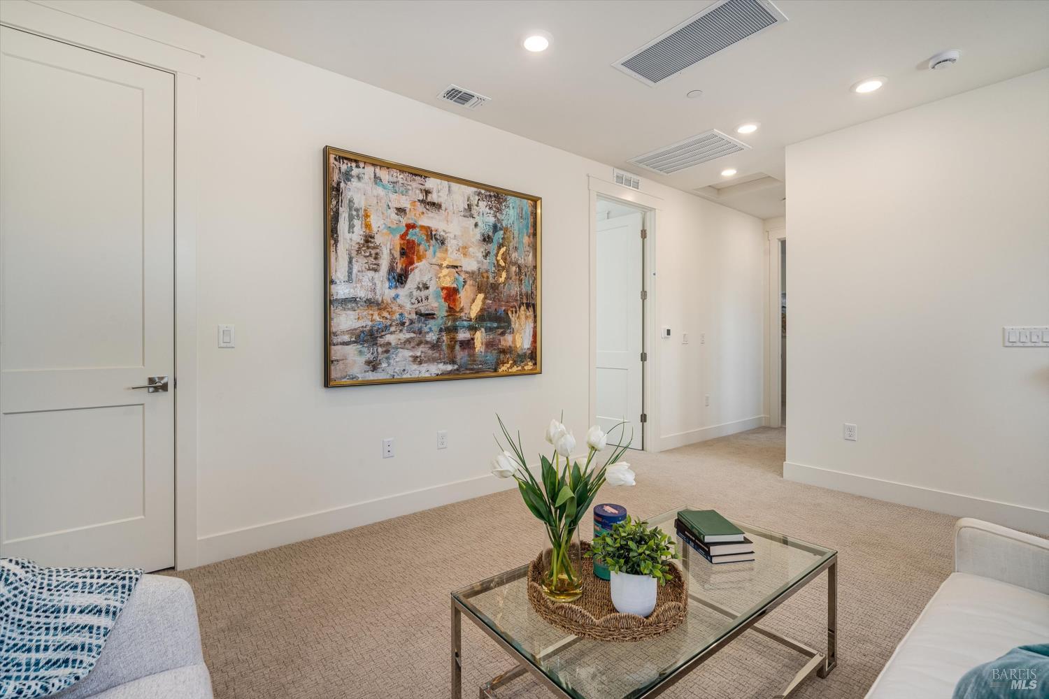 107 Grace Lane Napa, CA 94559 - Photo 31 of 39 a view of a hallway with paintings on the wall