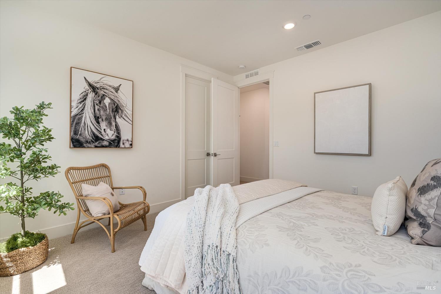 107 Grace Lane Napa, CA 94559 - Photo 32 of 39 a bedroom with a bed and chair