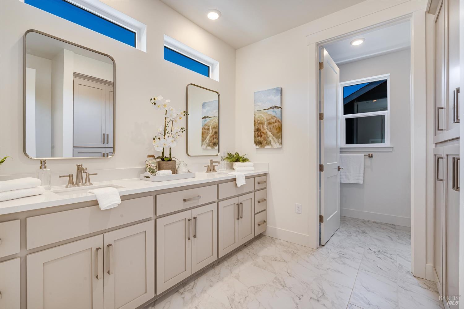 107 Grace Lane Napa, CA 94559 - Photo 35 of 39 a spacious bathroom with a double vanity sink a mirror and a shower