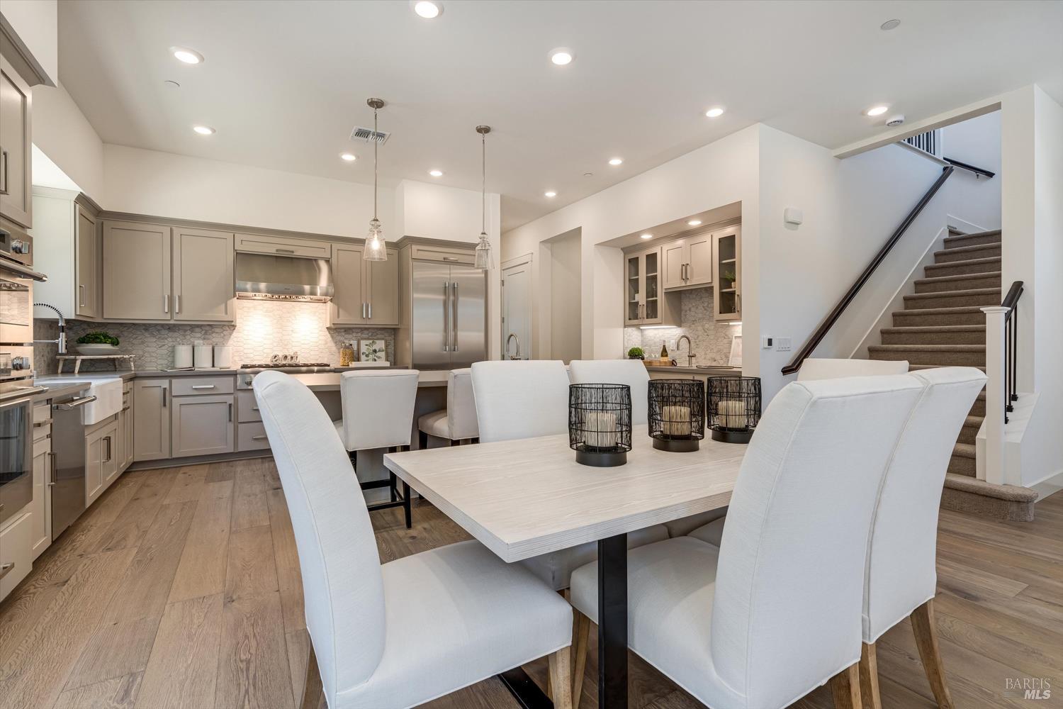 107 Grace Lane Napa, CA 94559 - Photo 10 of 39 a dining room with stainless steel appliances kitchen island granite countertop a dining table chairs and kitchen view