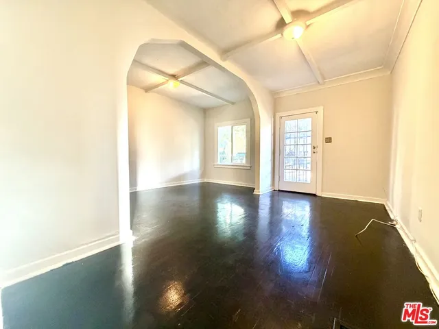 a view of a room with glass door