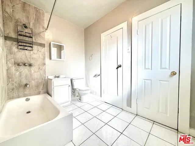 a bathroom with a bathtub and shower
