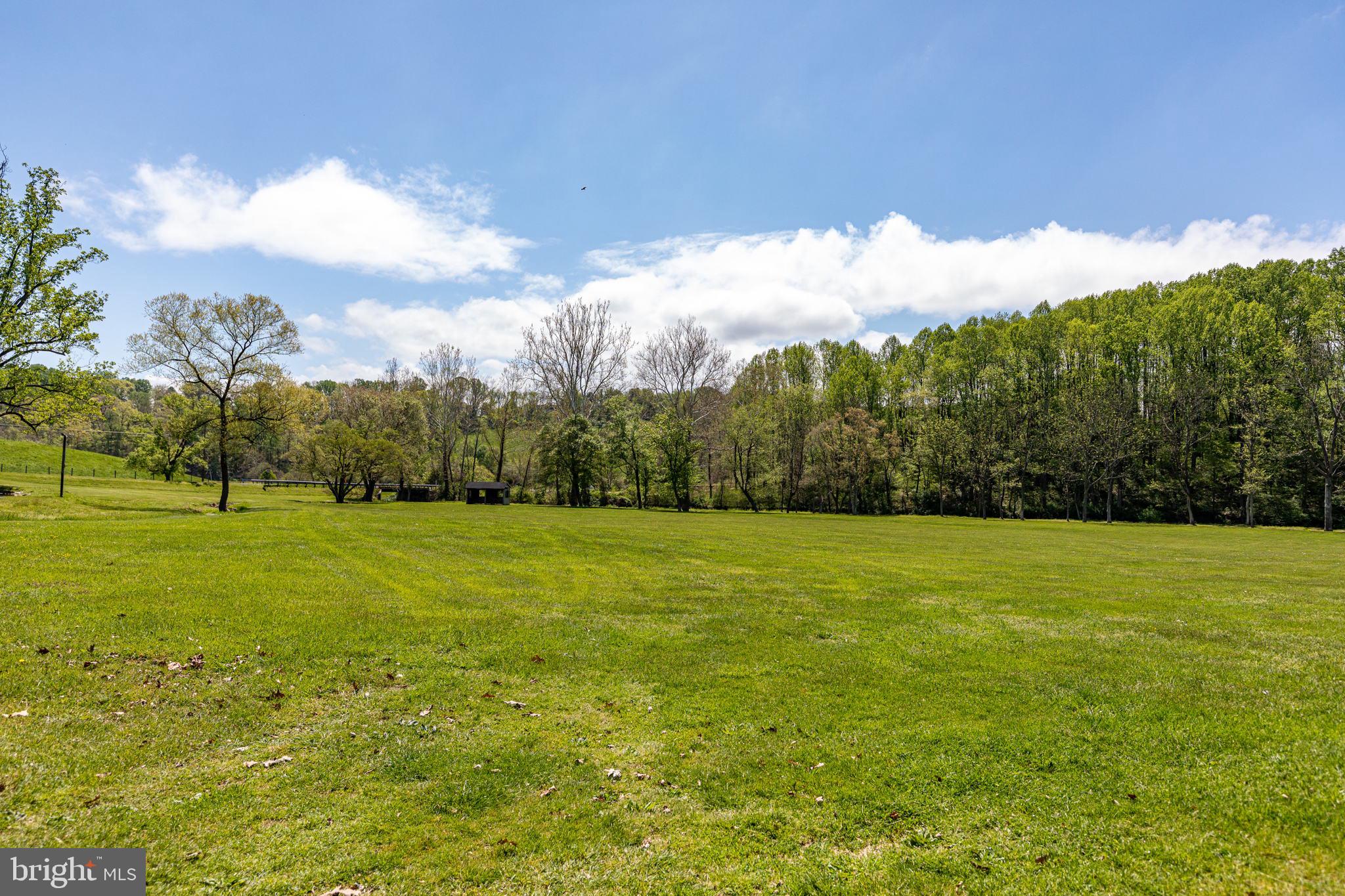 2310 Putnam Road Forest Hill, MD 21050 - Photo 15 of 90 Expansive green landscape under blue skies.