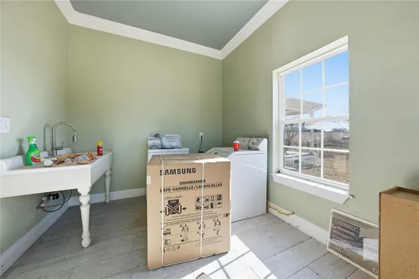 a view of a livingroom with wooden floor and stairs