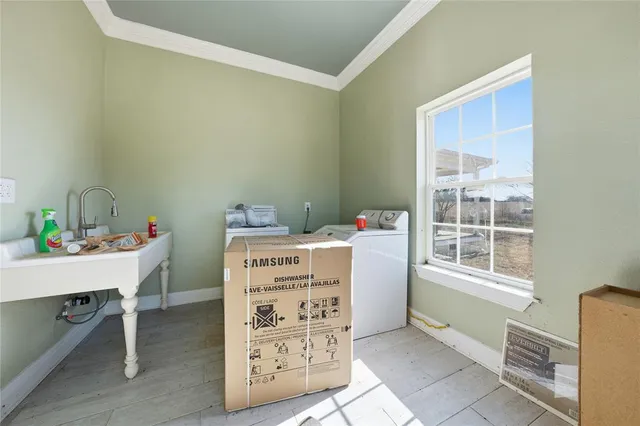 a view of a livingroom with wooden floor and stairs