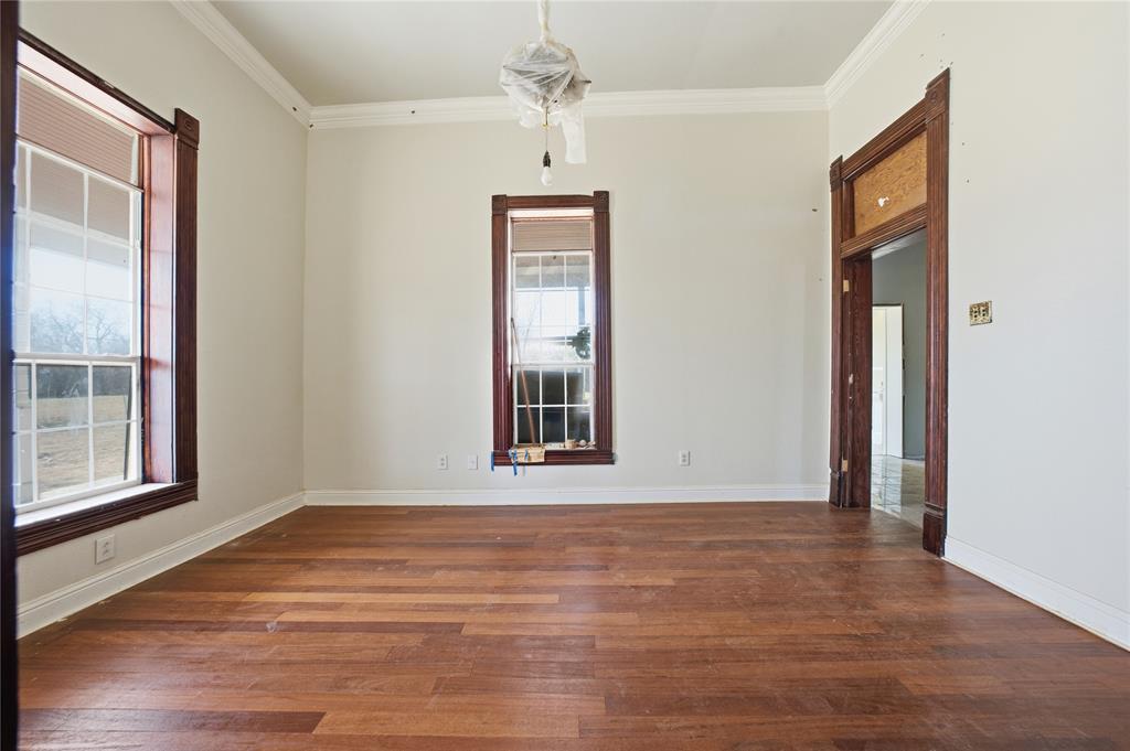 8640 Highway 198 Canton, TX 75103 - Photo 7 of 40 a view of an empty room with wooden floor and a window
