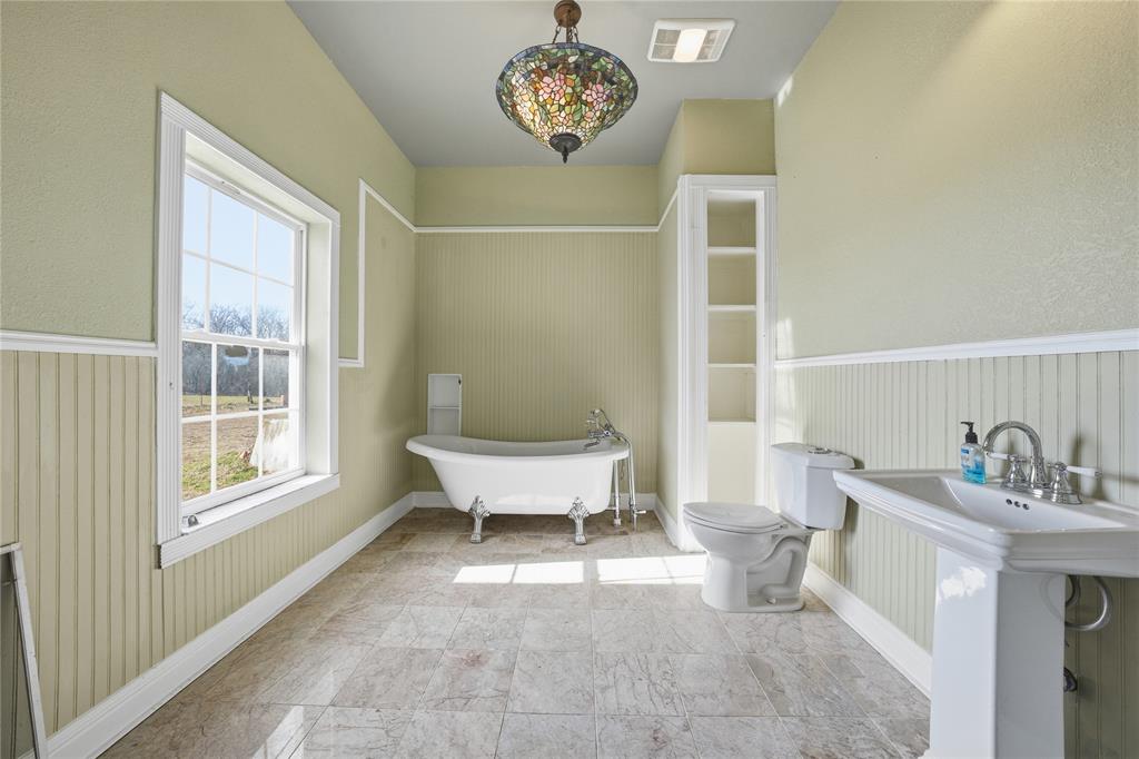 8640 Highway 198 Canton, TX 75103 - Photo 10 of 40 a bathroom with a sink and a mirror