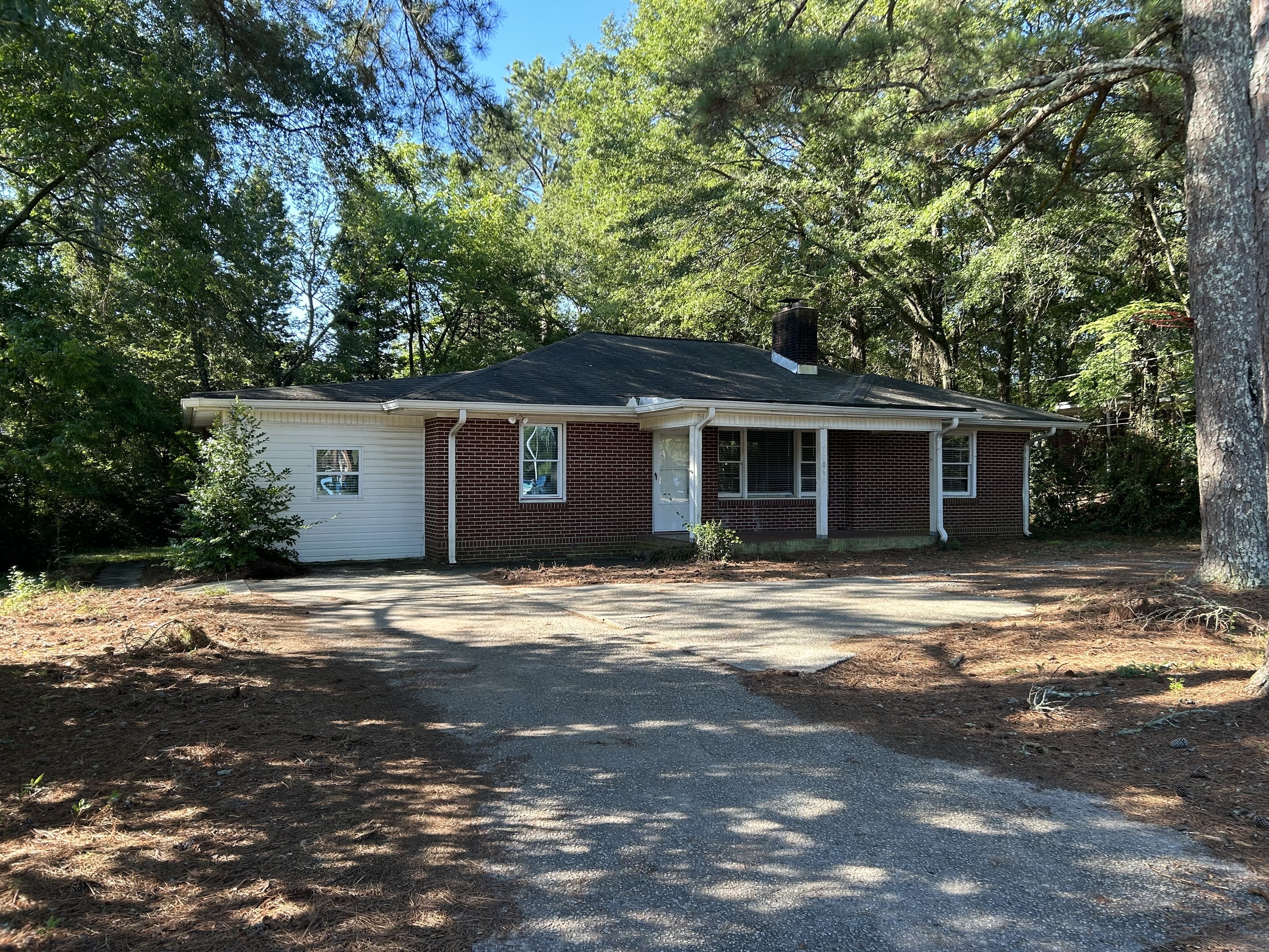 1806 Maple Street Carrollton, GA 30117 - Photo 1 of 1 a front view of a house with a yard and garage