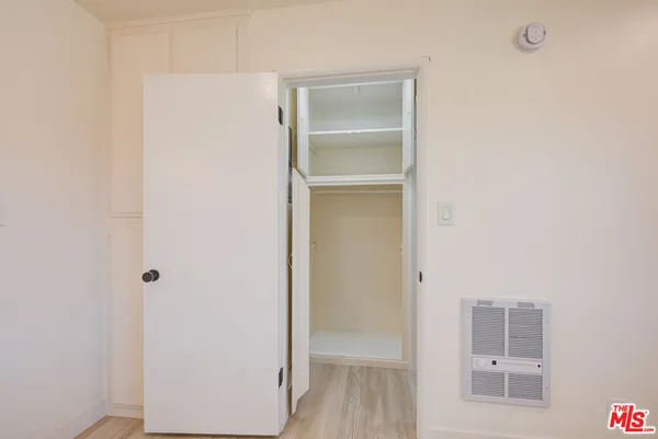 a bathroom with a shower toilet and sink