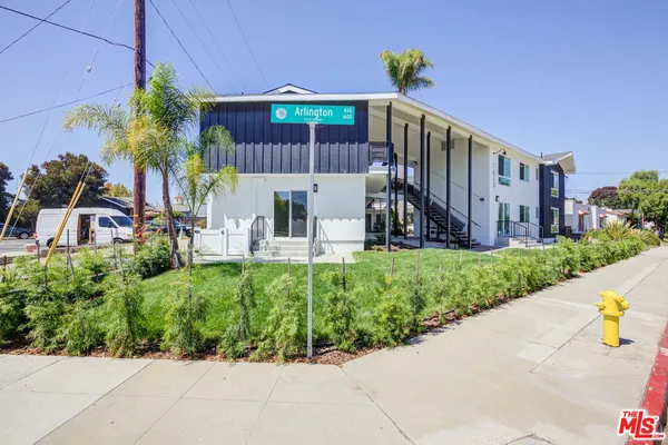 a view of a chair and table in the garden