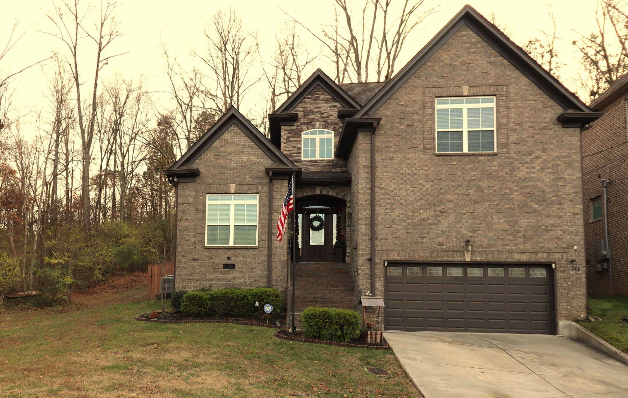 741 Bloomdale Trace Hermitage, TN 37076 - Photo 1 of 6 a front view of a house with garden