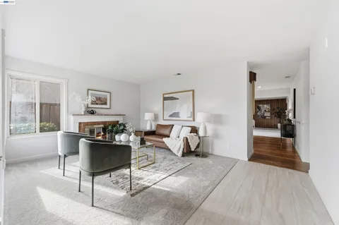 a living room with furniture and a table