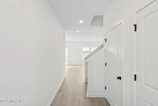 a view of a hallway with stairs