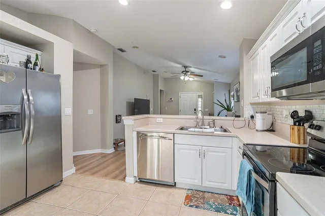 a kitchen with a sink stove and refrigerator