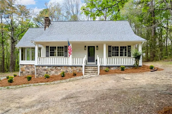 front view of a house with a yard