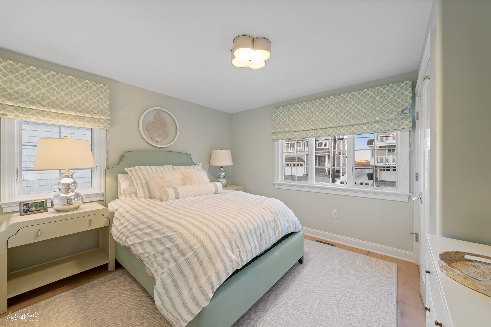 526 7th Street Avalon, NJ 08202 - Photo 13 of 24 a bedroom with a bed and a window