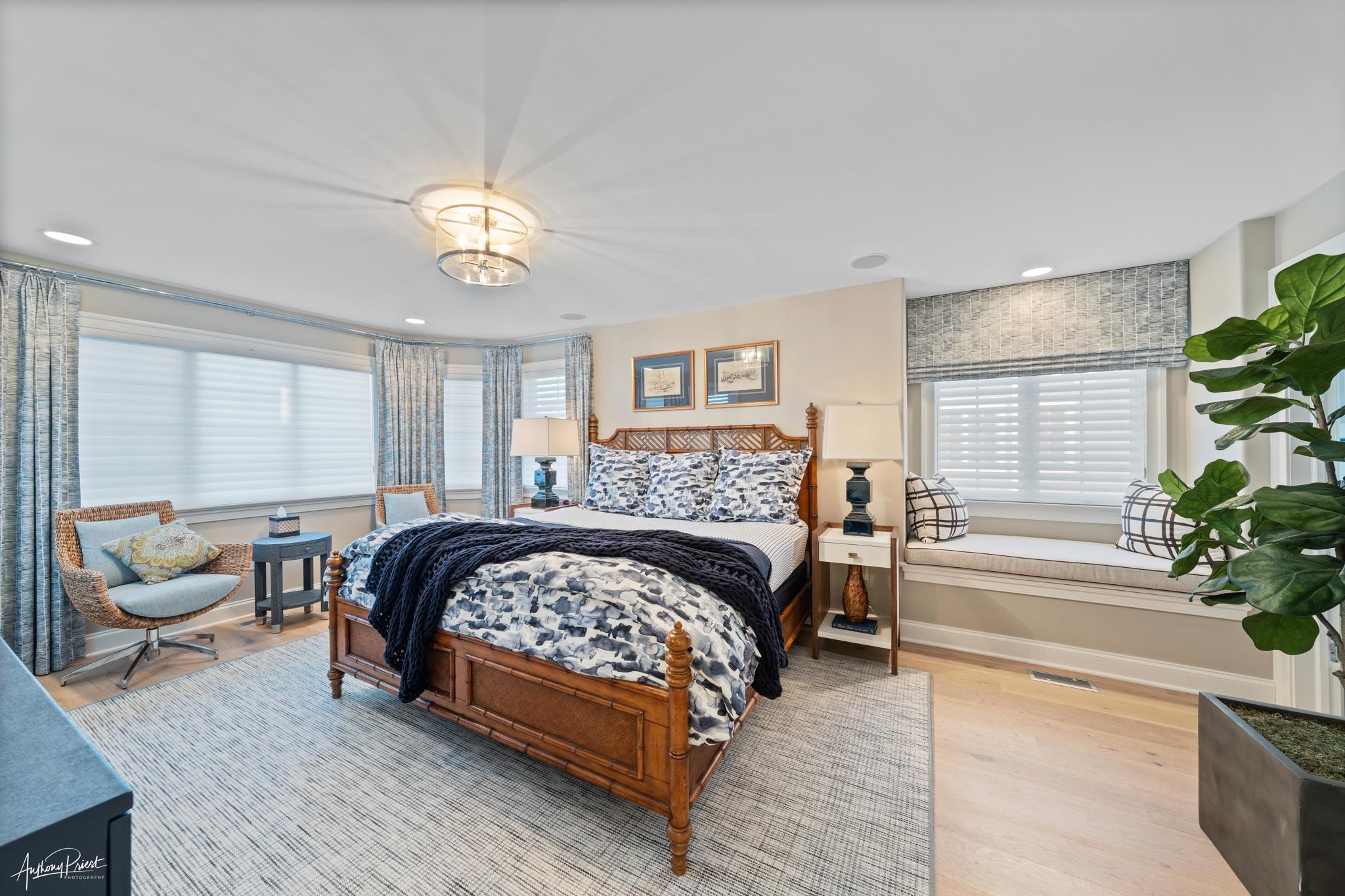 526 7th Street Avalon, NJ 08202 - Photo 18 of 24 a bedroom with a bed and a chandelier