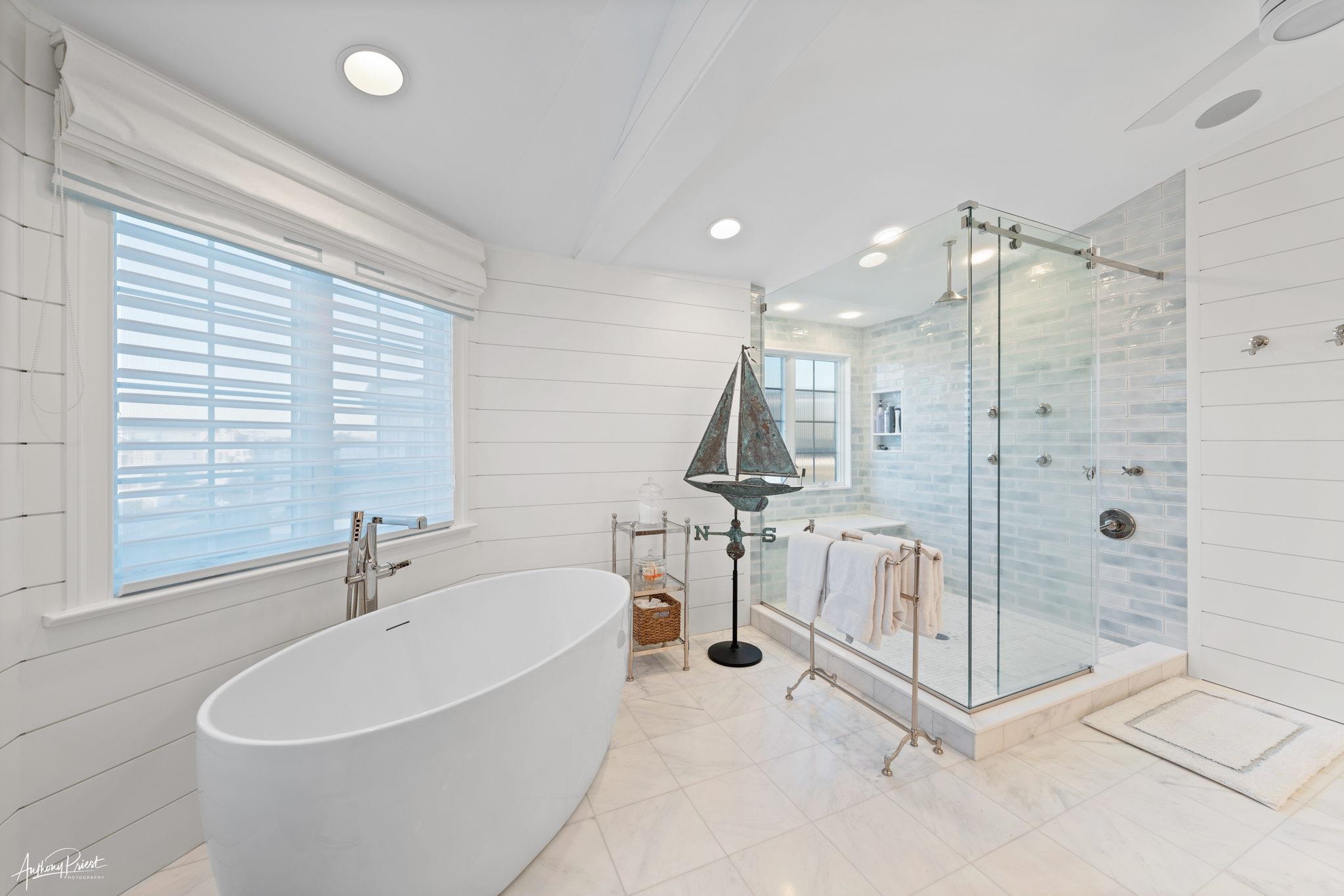 526 7th Street Avalon, NJ 08202 - Photo 19 of 24 a bathroom with a tub and a shower