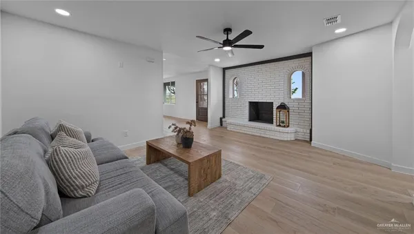 a living room with furniture and a fireplace