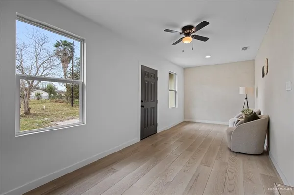 a view of an empty room with a window