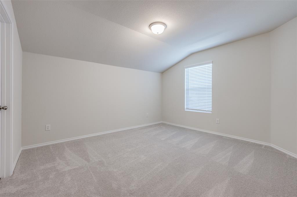 877 Table Rock Street Princeton, TX 75407 - Photo 19 of 25 an empty room with a window