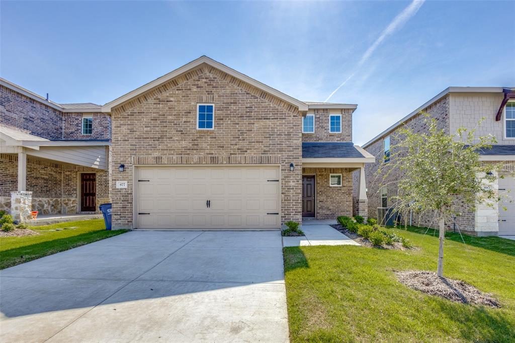 877 Table Rock Street Princeton, TX 75407 - Photo 2 of 25 a front view of a house with garden