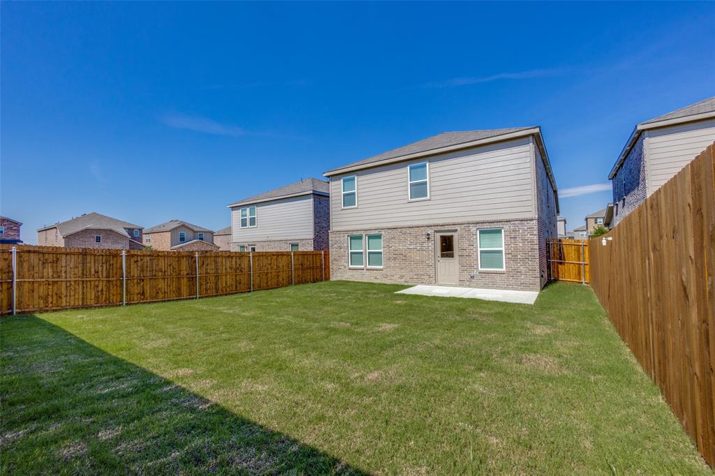 877 Table Rock Street Princeton, TX 75407 - Photo 23 of 25 a view of a house with a yard and more fence