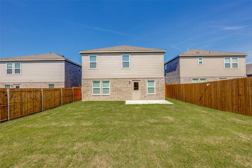 877 Table Rock Street Princeton, TX 75407 - Photo 24 of 25 a view of an house with backyard and kitchen