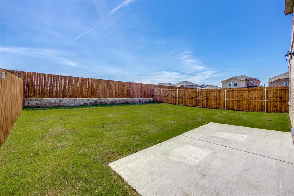 877 Table Rock Street Princeton, TX 75407 - Photo 25 of 25 a view of yard with swimming pool and green space
