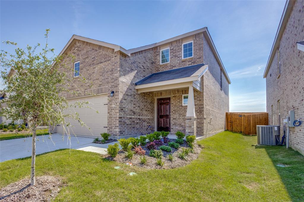 877 Table Rock Street Princeton, TX 75407 - Photo 3 of 25 a front view of a house with a yard