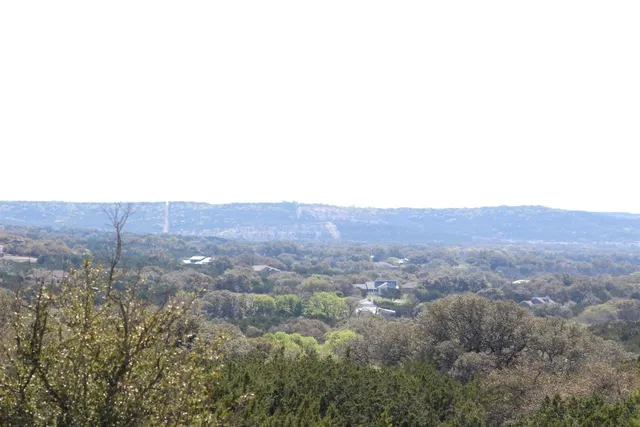 an aerial view of residential house and sandy dunes