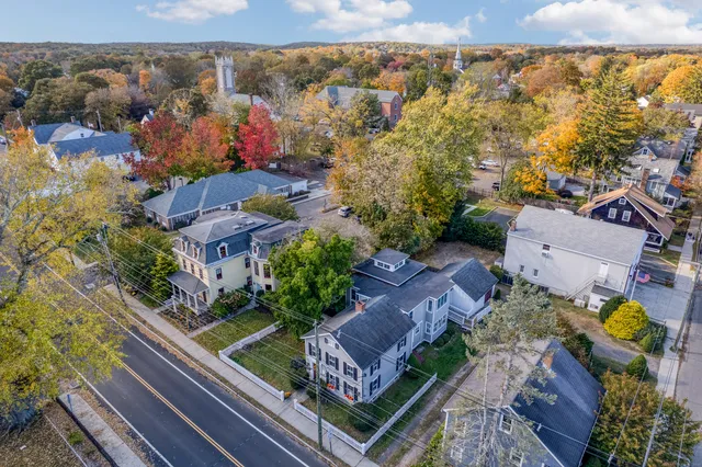 an aerial view of residential houses with outdoor space
