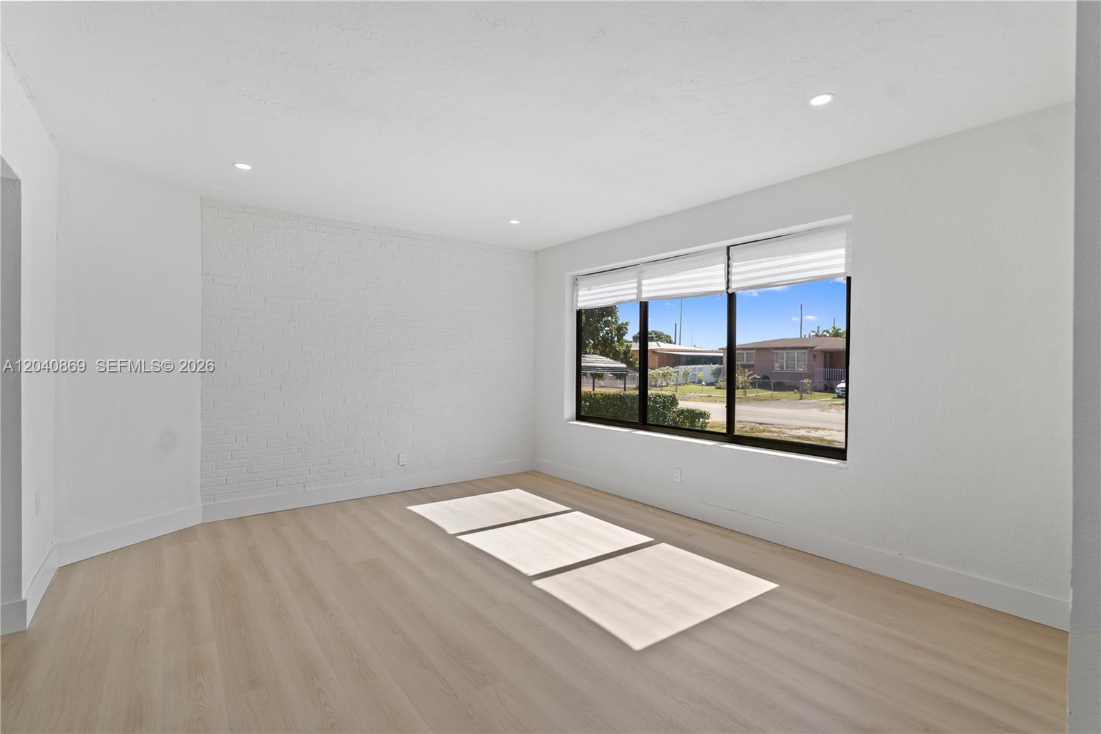 31 West 64th Street Hialeah, FL 33012 - Photo 5 of 49 an empty room with windows