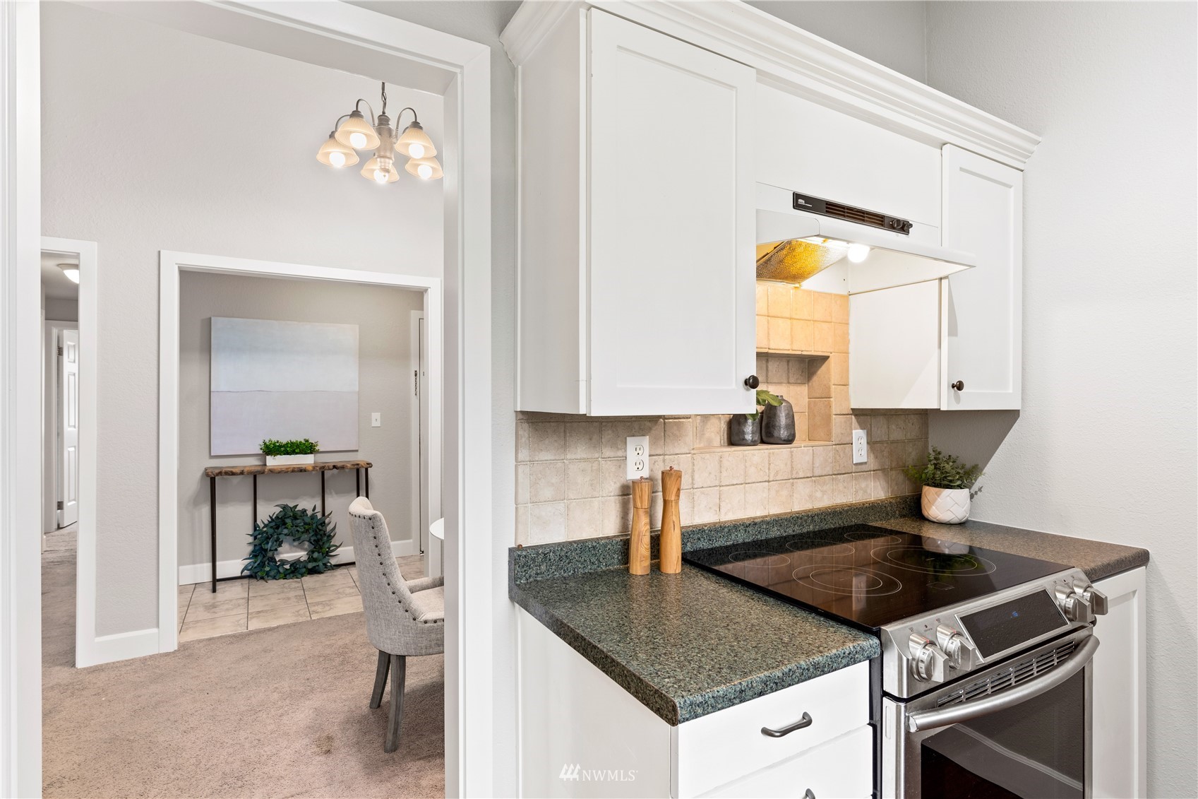 820 Cady Road, Unit C302 Everett, WA 98203 - Photo 8 of 25 a kitchen with a stove a sink and a refrigerator