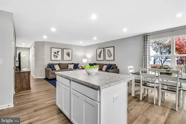 a kitchen with lots of counter top space and stainless steel appliances
