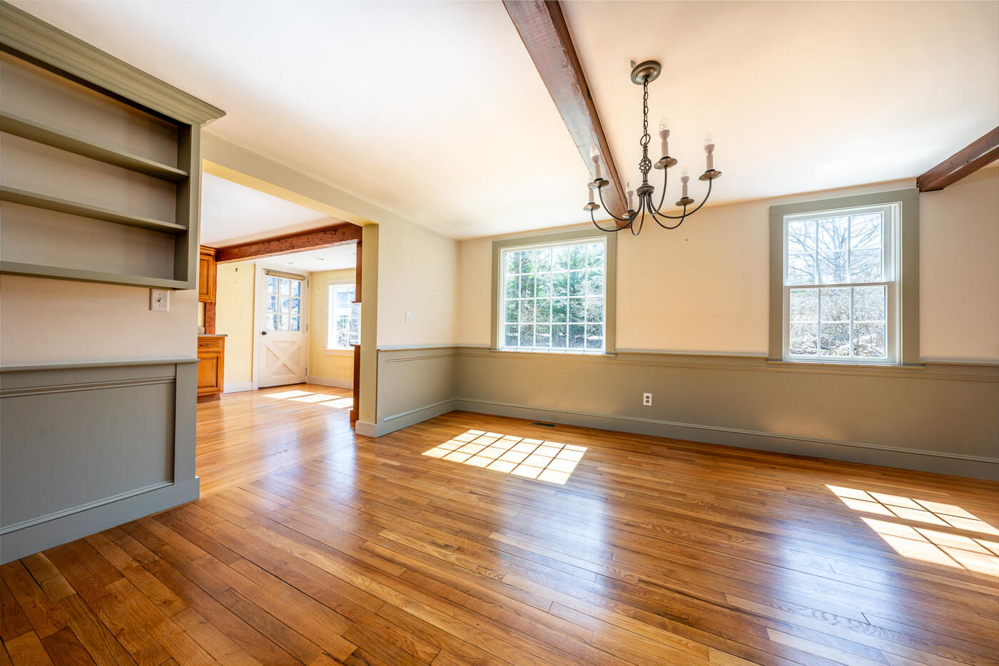 58 Pine Lane Barnstable, MA 02630 - Photo 14 of 37 a view of an empty room with wooden floor and a window