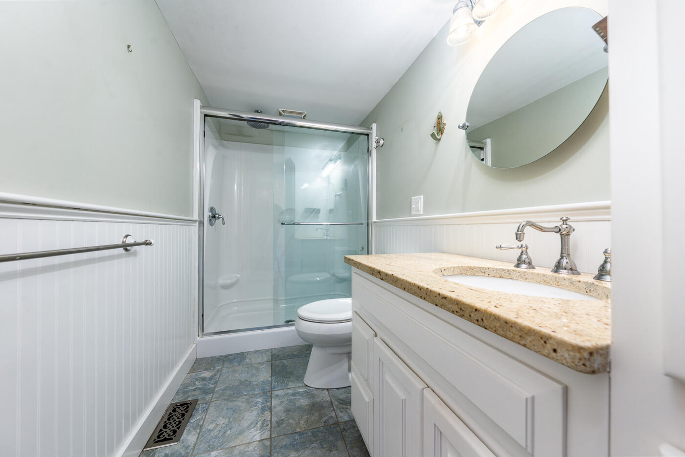 58 Pine Lane Barnstable, MA 02630 - Photo 20 of 37 a bathroom with a granite countertop sink a toilet and a mirror