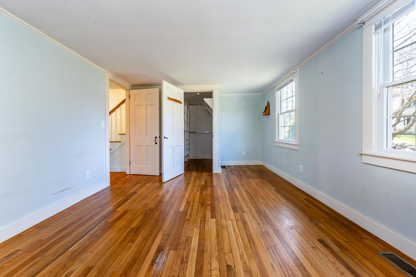 58 Pine Lane Barnstable, MA 02630 - Photo 22 of 37 an empty room with wooden floor and windows