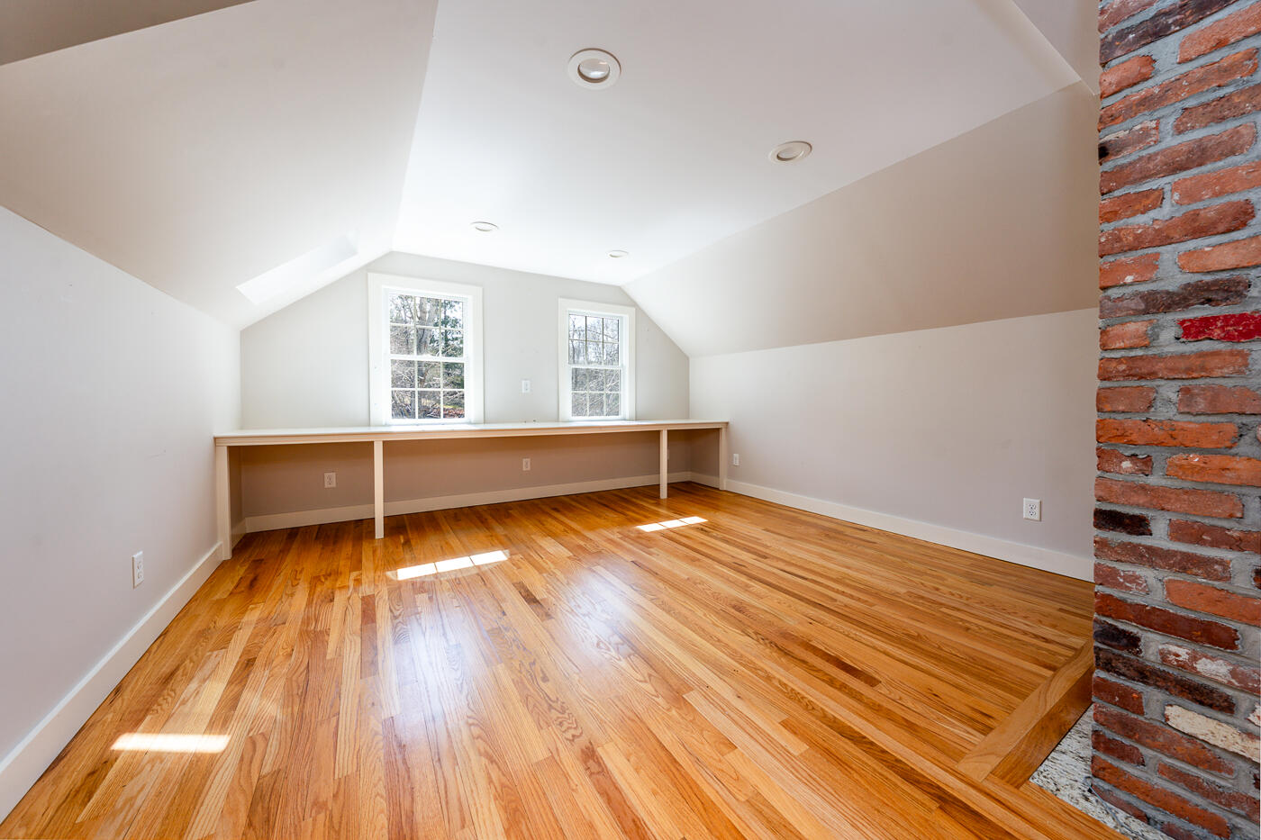 58 Pine Lane Barnstable, MA 02630 - Photo 25 of 37 a view of an empty room with wooden floor and a window