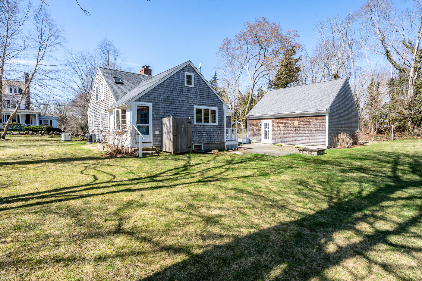 58 Pine Lane Barnstable, MA 02630 - Photo 32 of 37 a view of a house with a big yard and large trees