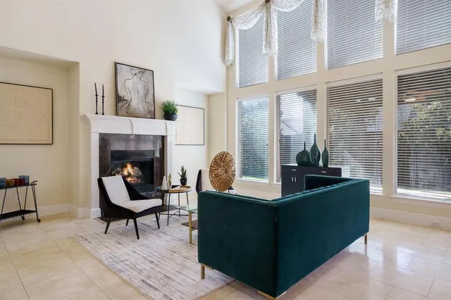 a kitchen with granite countertop a refrigerator and a sink