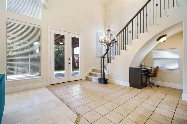 a kitchen with granite countertop kitchen island stainless steel appliances a stove a sink a refrigerator a stove a dining table and chairs