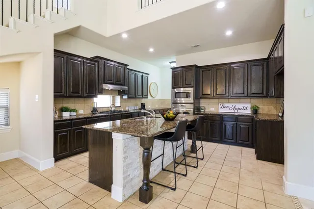 a spacious bedroom with a bed and a couch