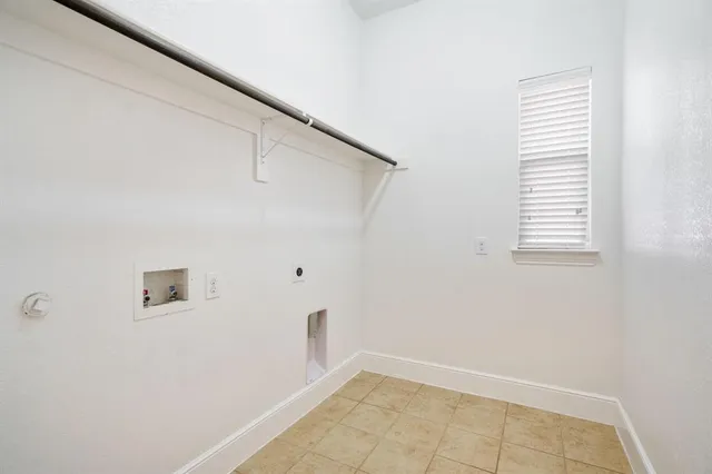 a view of a hallway to a livingroom and a chandelier