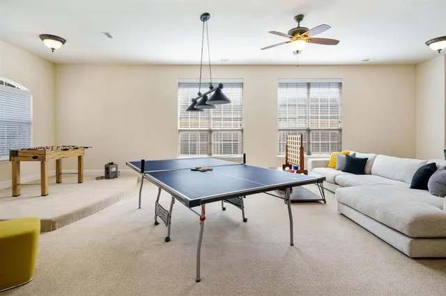 a bathroom with a granite countertop sink a mirror and shower