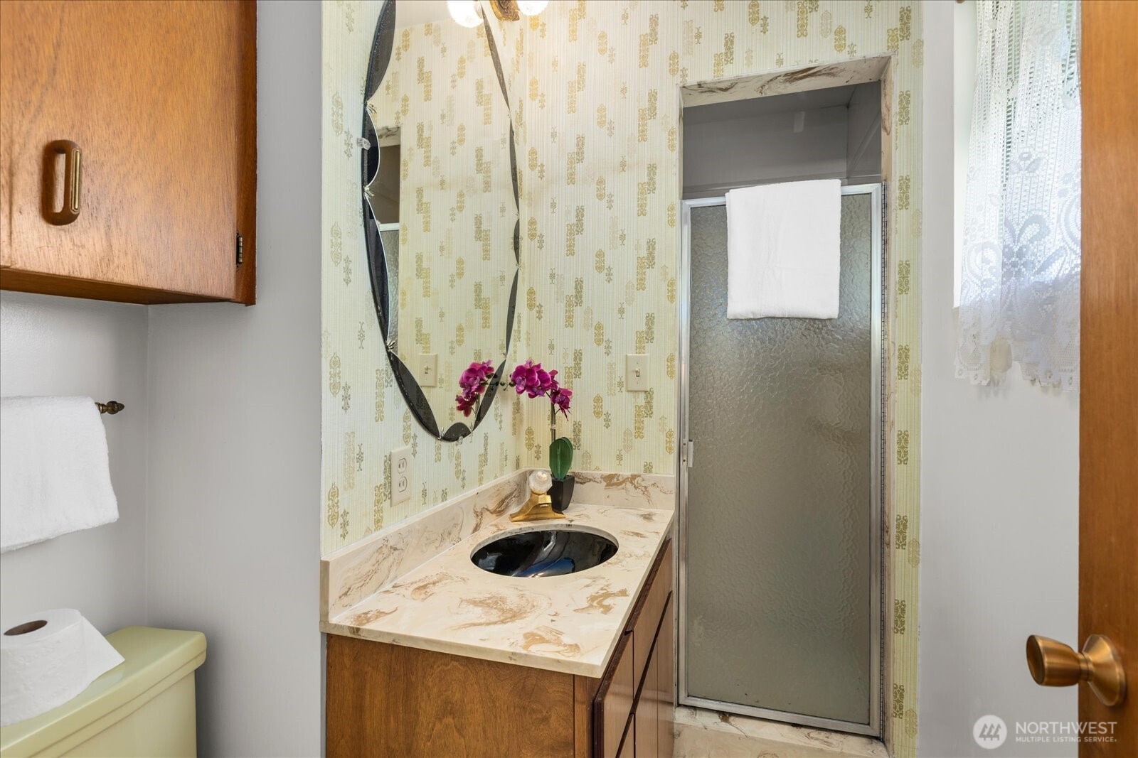 1420 Olympic Avenue Edmonds, WA 98020 - Photo 18 of 40 a bathroom with a sink and mirror