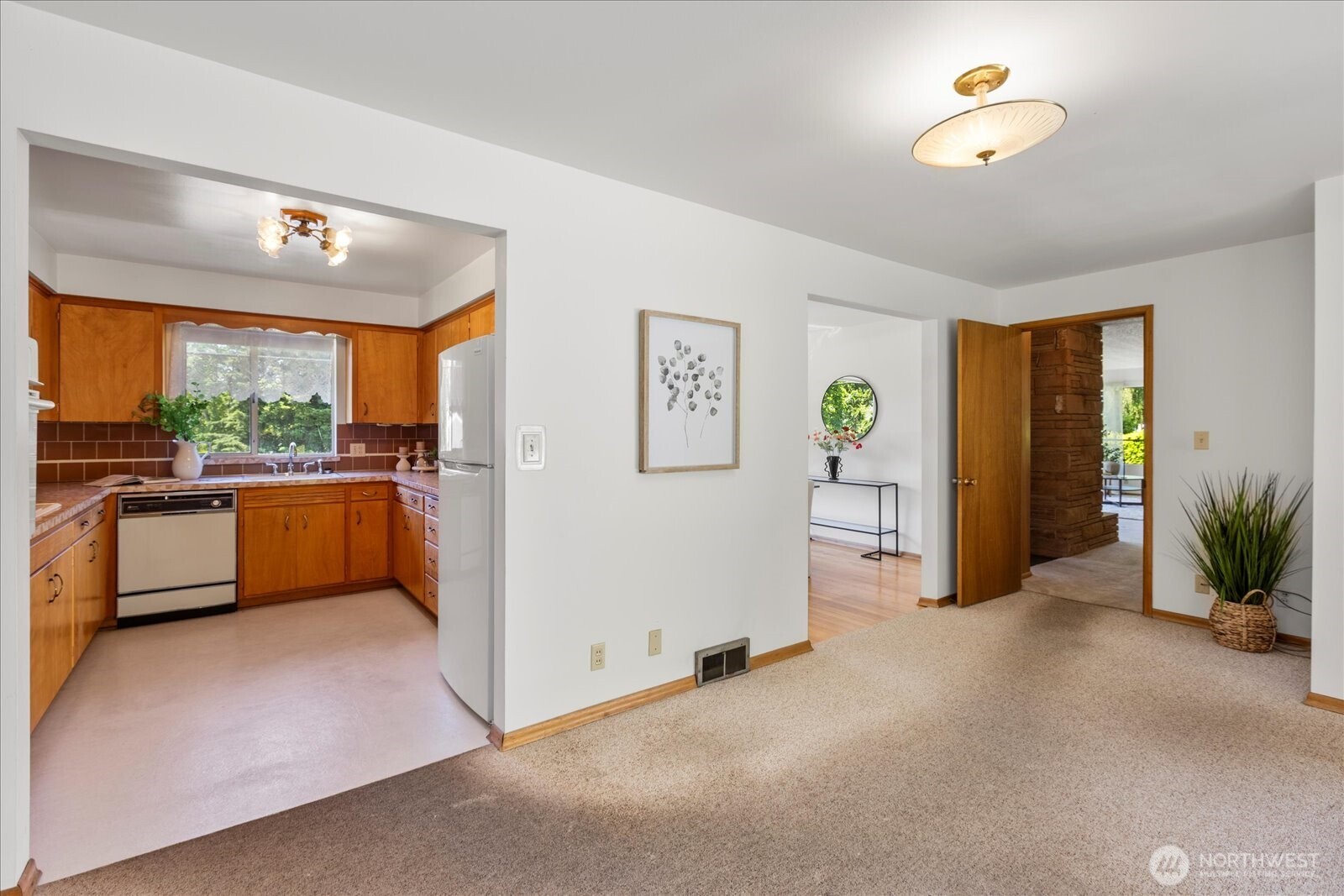 1420 Olympic Avenue Edmonds, WA 98020 - Photo 29 of 40 a view of a kitchen with furniture and a ceiling fan